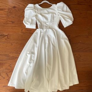 Elagia, white tea length dress. Size Medium(see size chart for details).